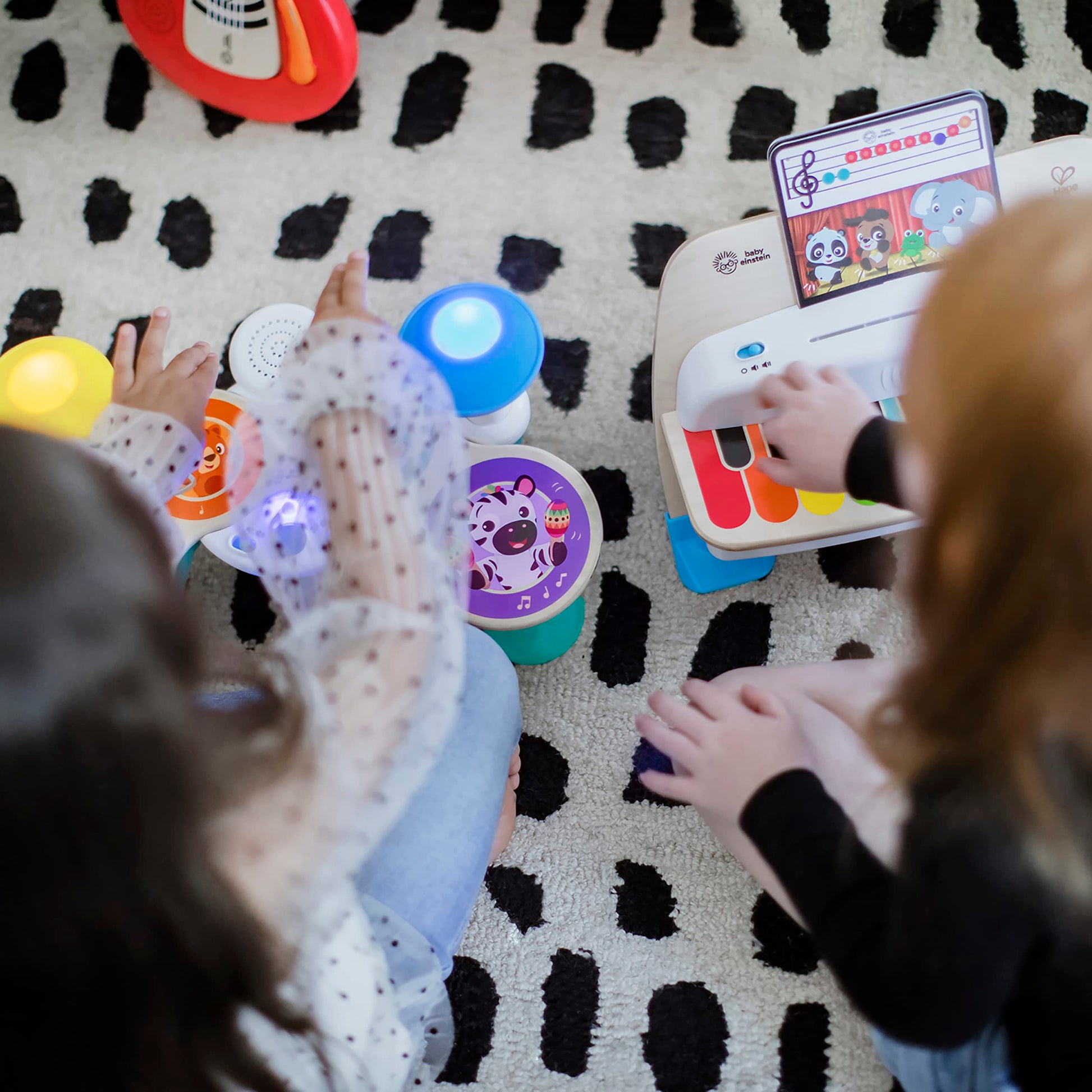 Baby Einstein Together in Tune Drums toddler musical toy with wireless wooden drums and magic touch controls for ages 12 months+.