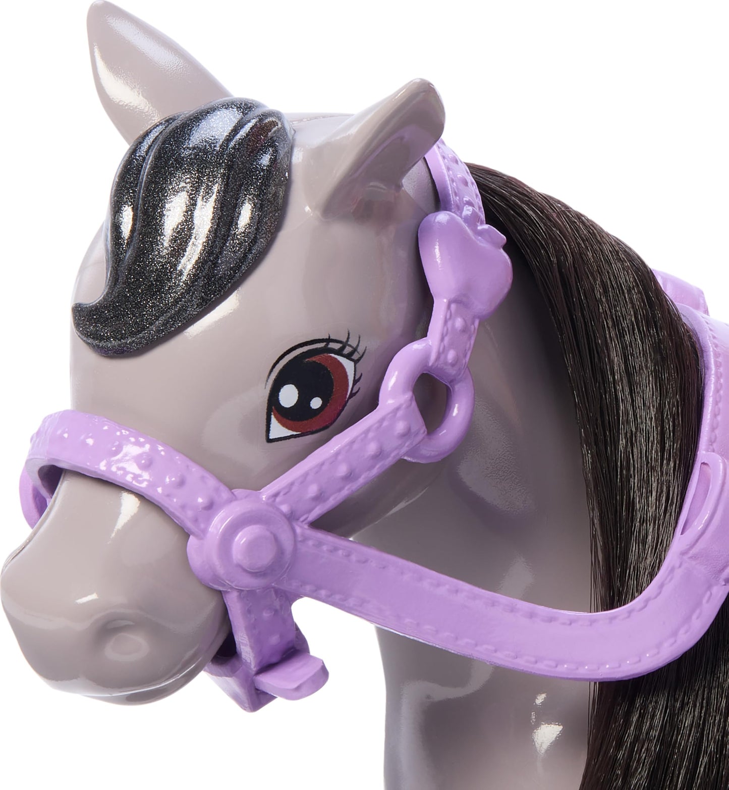 Barbie Chelsea doll with a gray toy pony, wearing helmet, with saddle and kneeling to simulate riding in this detailed set.