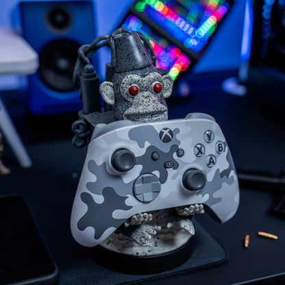 Cableguys Monkey Bomb controller holder and phone stand for gaming, compatible with Xbox, PlayStation, and standard controllers.