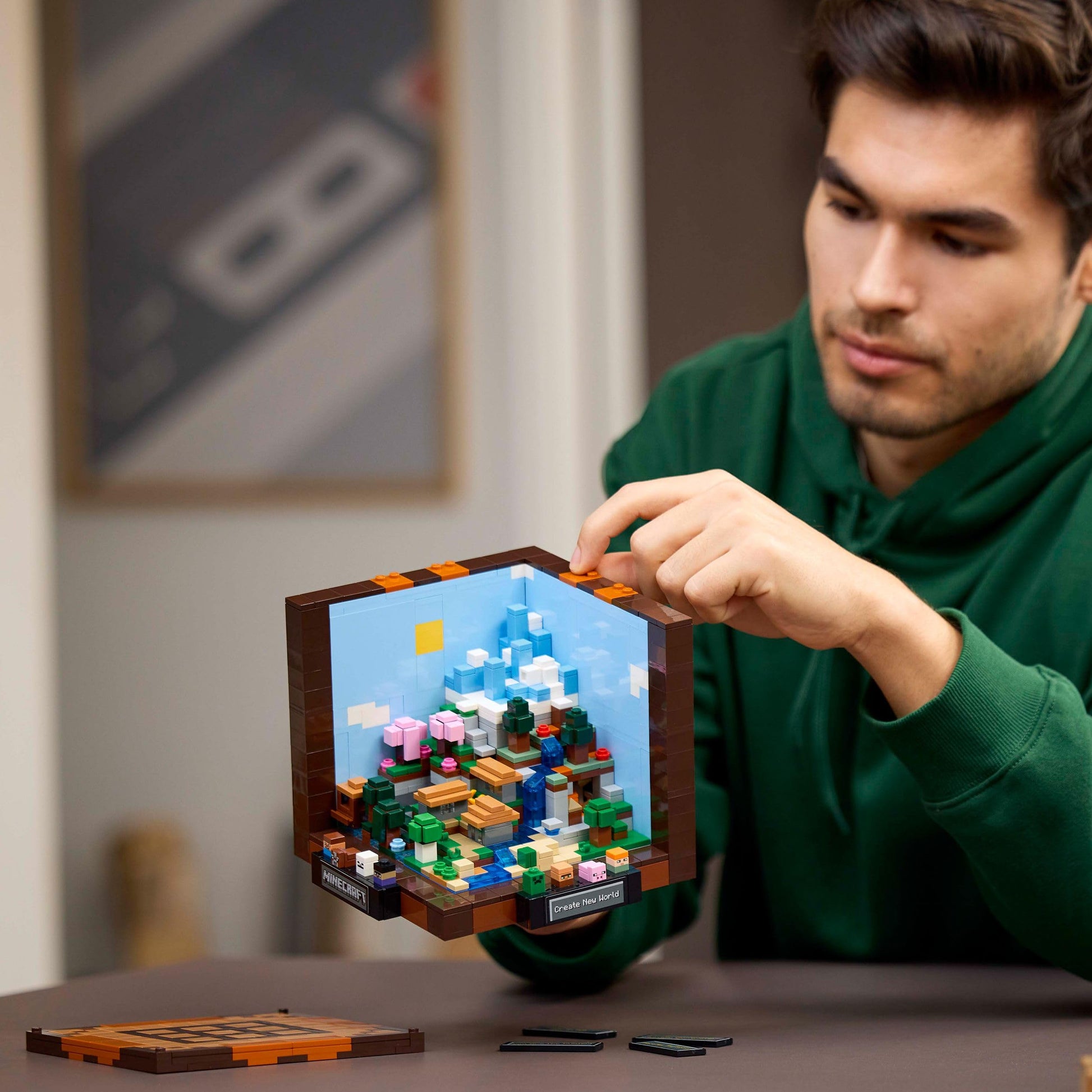 LEGO Minecraft The Crafting Table set with Steve, Alex, and 8 characters, showcasing detailed building model for display.