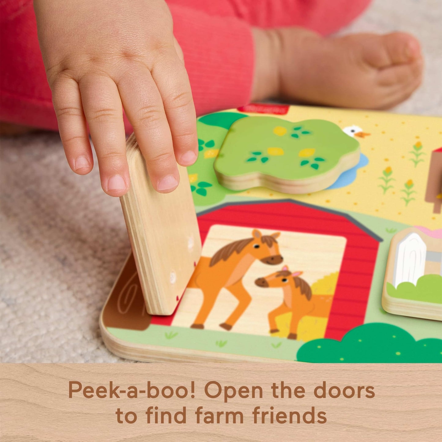 Fisher-Price wooden baby toy farm animals board with colorful animal figures for infants and toddlers to promote fine motor skills.