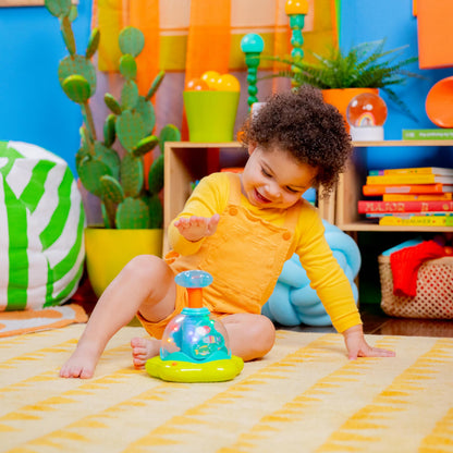 Bright Starts Press and Glow Spinner musical baby toy with multicoloured buttons and cause-and-effect features for babies 6 months+.