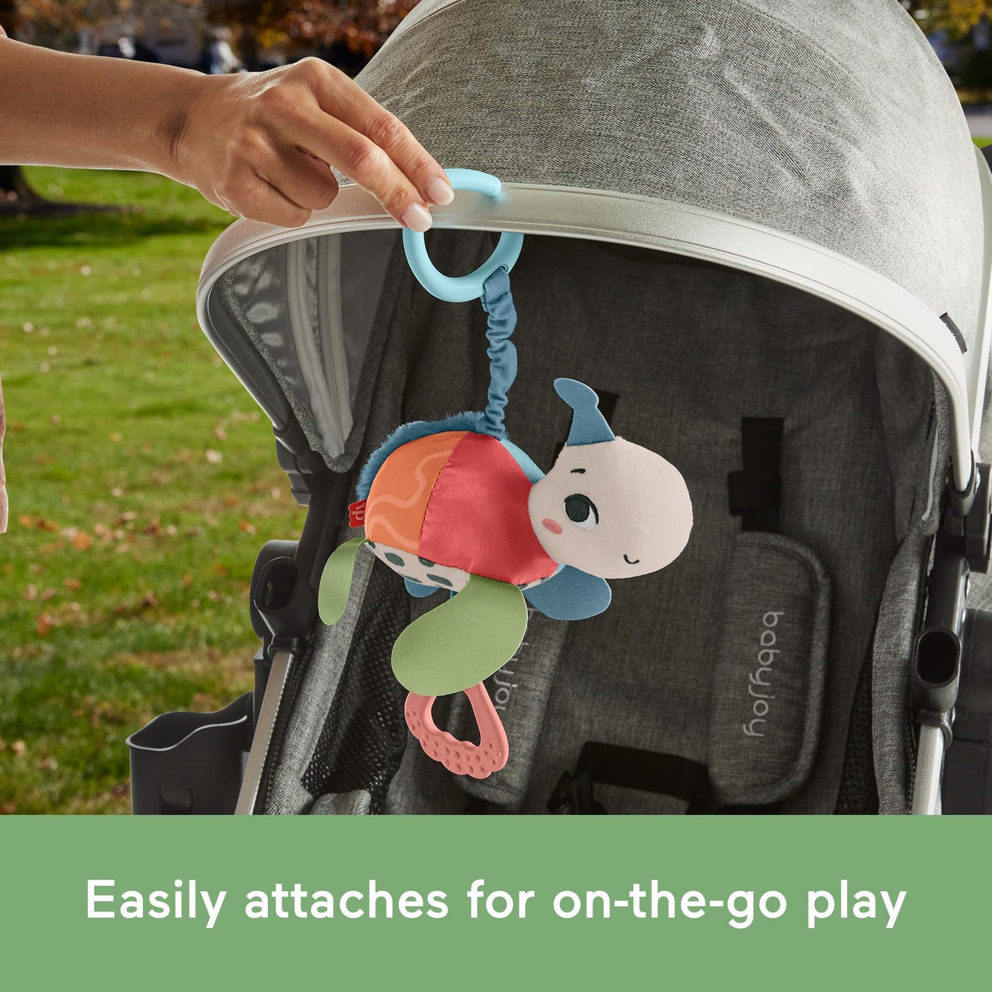Fisher-Price Baby Stroller Toy Planet Friends Sea Me Bounce Turtle with teether, bouncing motion, and sounds for newborns.