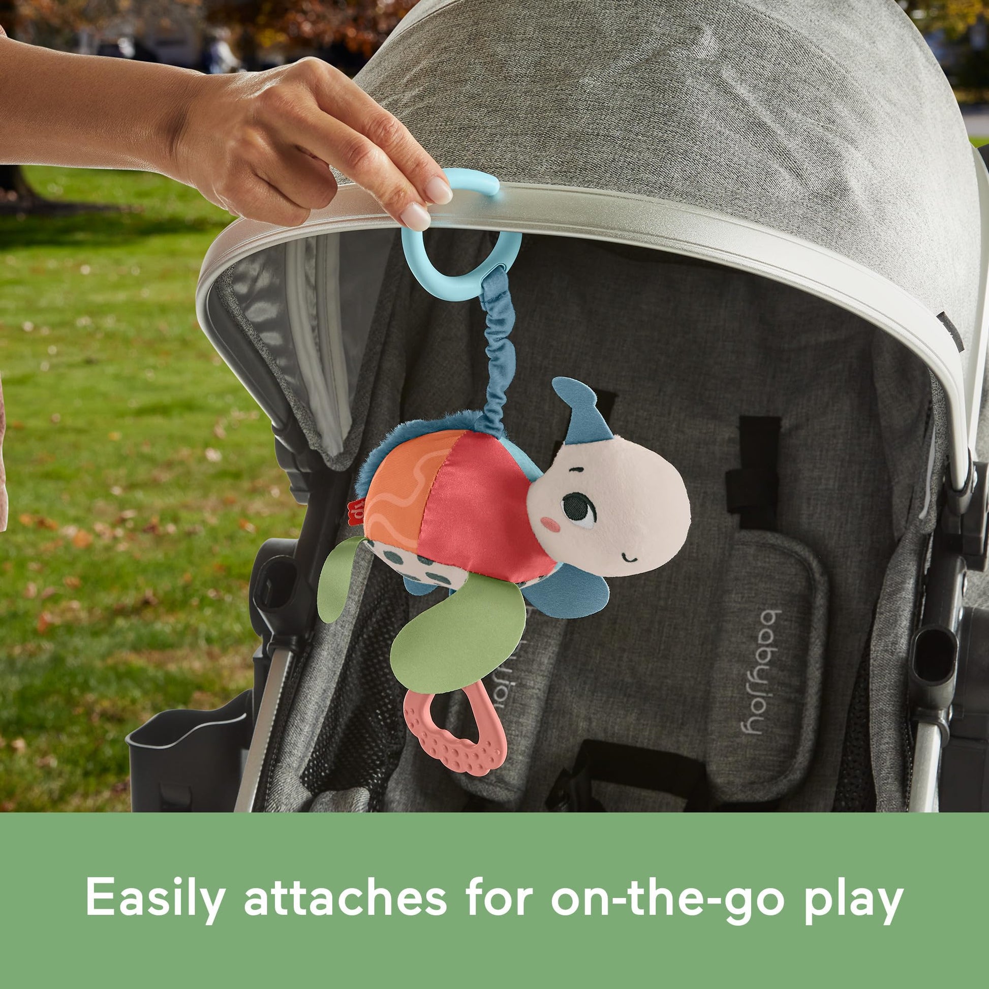 Fisher-Price Baby Stroller Toy Planet Friends Sea Me Bounce Turtle with teether, bouncing motion, and sounds for newborns.