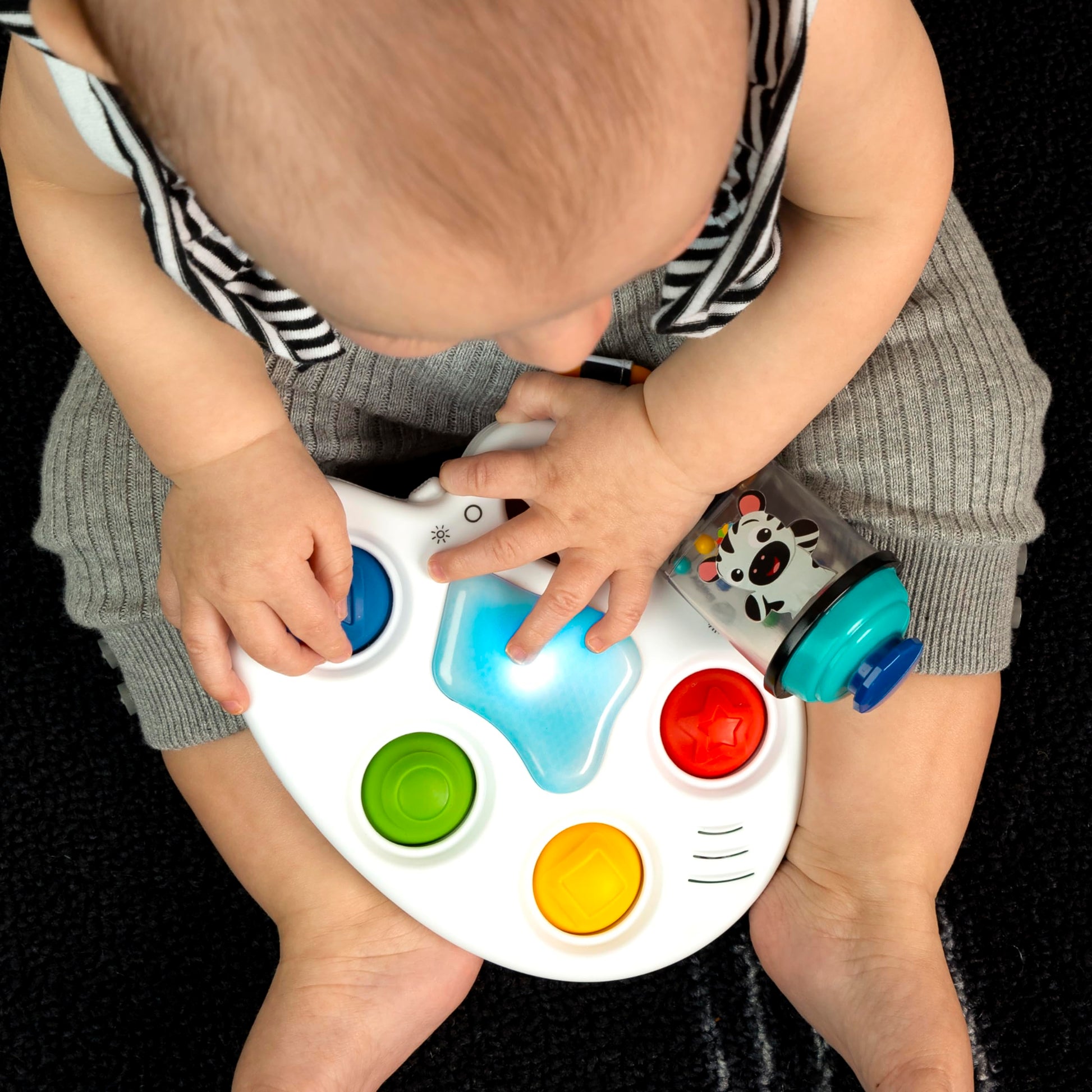 Baby Einstein Color Palette Popper sensory fidget toy for infants 6 months and up, featuring colorful, easy-to-press poppers for tactile play.