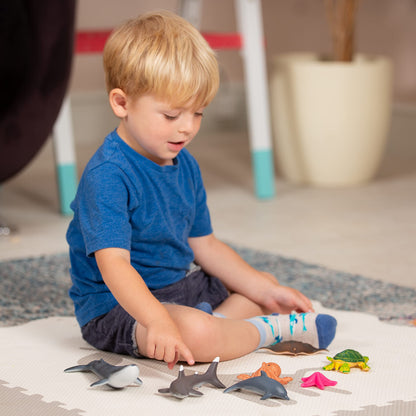 Set of 7 Learning Minds jumbo sea animal figures including shark, whale, and dolphin toys for children aged 18 months and up.