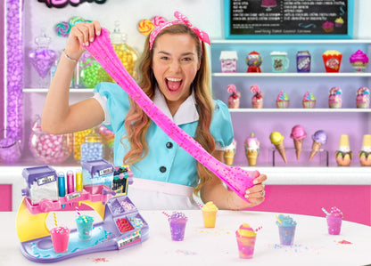 Canal Toys So Slime DIY Slimelicious Slime Station with colorful slime, decorations, shakers, and mixing tools for making scented slimes.