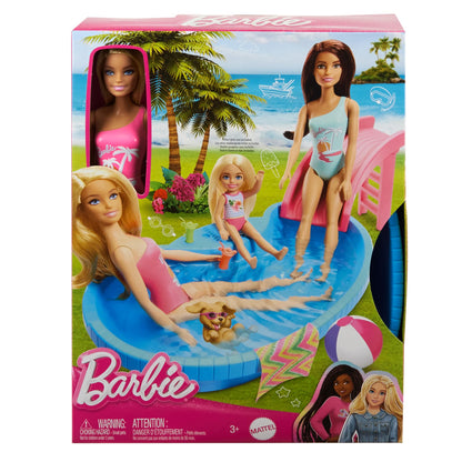 Barbie doll with blonde hair in a pink swimsuit, beside a pool with a slide, towel, and drink accessories.