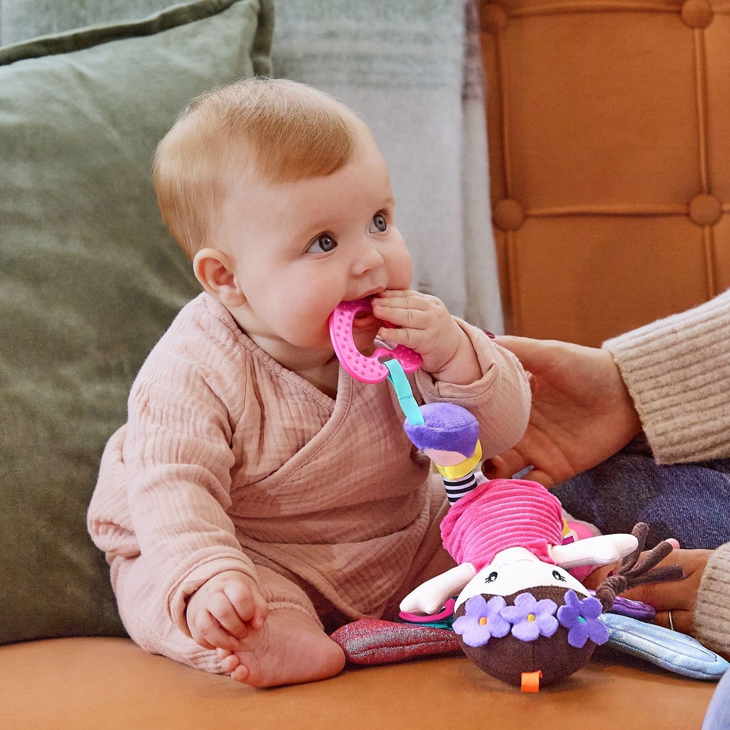 Colorful Nuby Things with Wings fairy pram toy with mirror, teething features, and universal clip for baby sensory play.