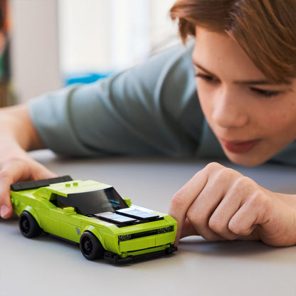 LEGO Speed Champions Dodge Challenger SRT Hellcat model kit with a driver minifigure, showcasing a detailed sports car design.