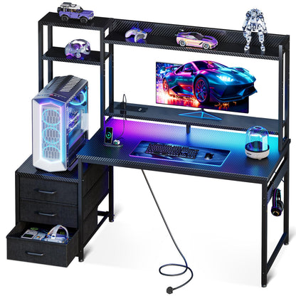 Coleshome gaming desk with drawers, display shelves, LED lights, sockets, monitor stand, and carbon fiber black finish.