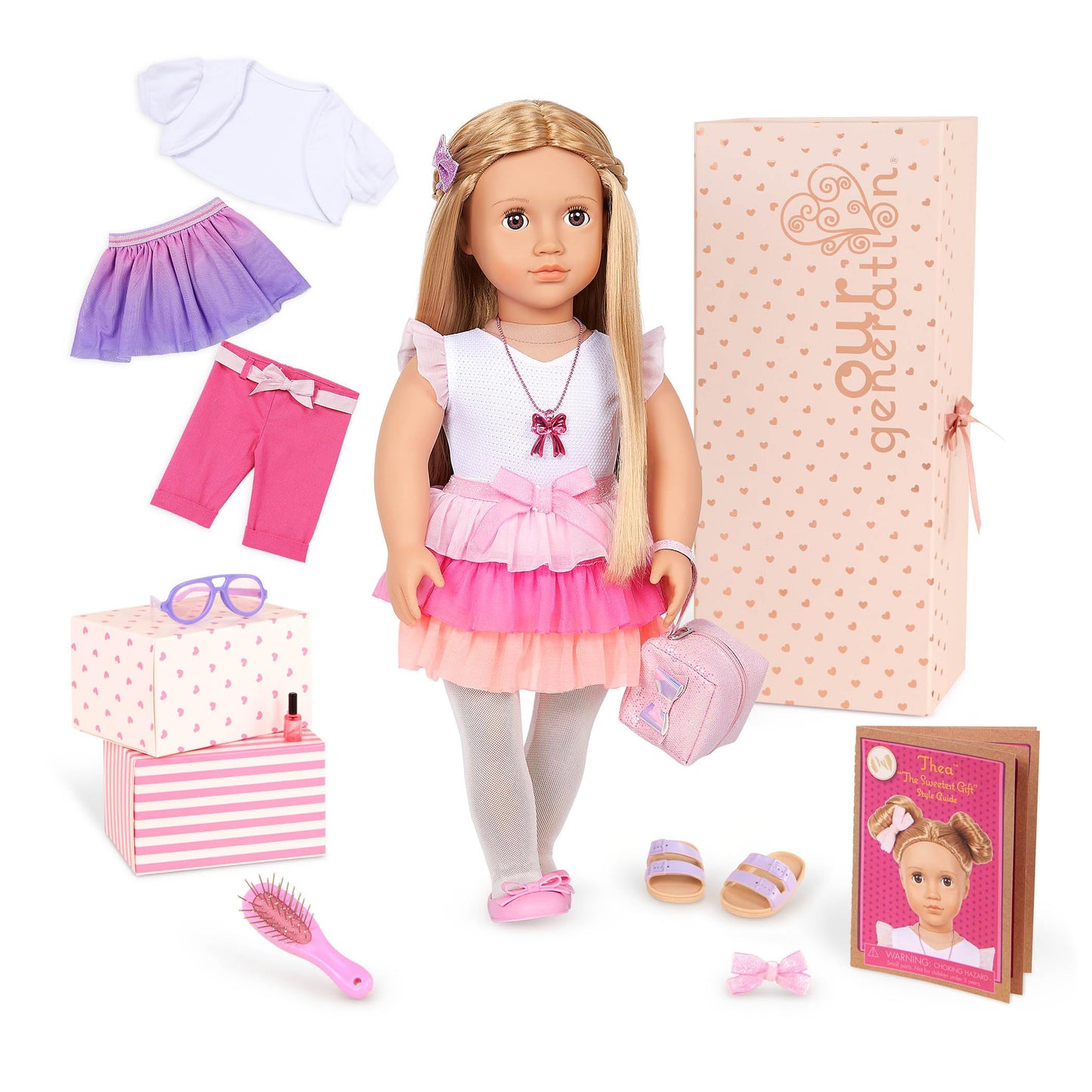 18-inch Our Generation doll Thea with blonde hair, hazel eyes, bow-themed outfits, and styling accessories in gift box.