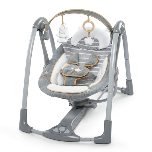 Ingenuity Swing 'n Go Deluxe baby swing with cushioned harness, plush toys, and sounds, suitable for infants 0-9 months.