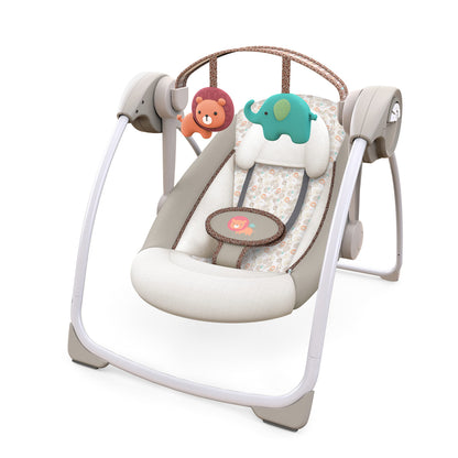 Ingenuity Soothe 'n Delight portable baby swing with music and toy bar, compact design, for easy travel and soothing comfort