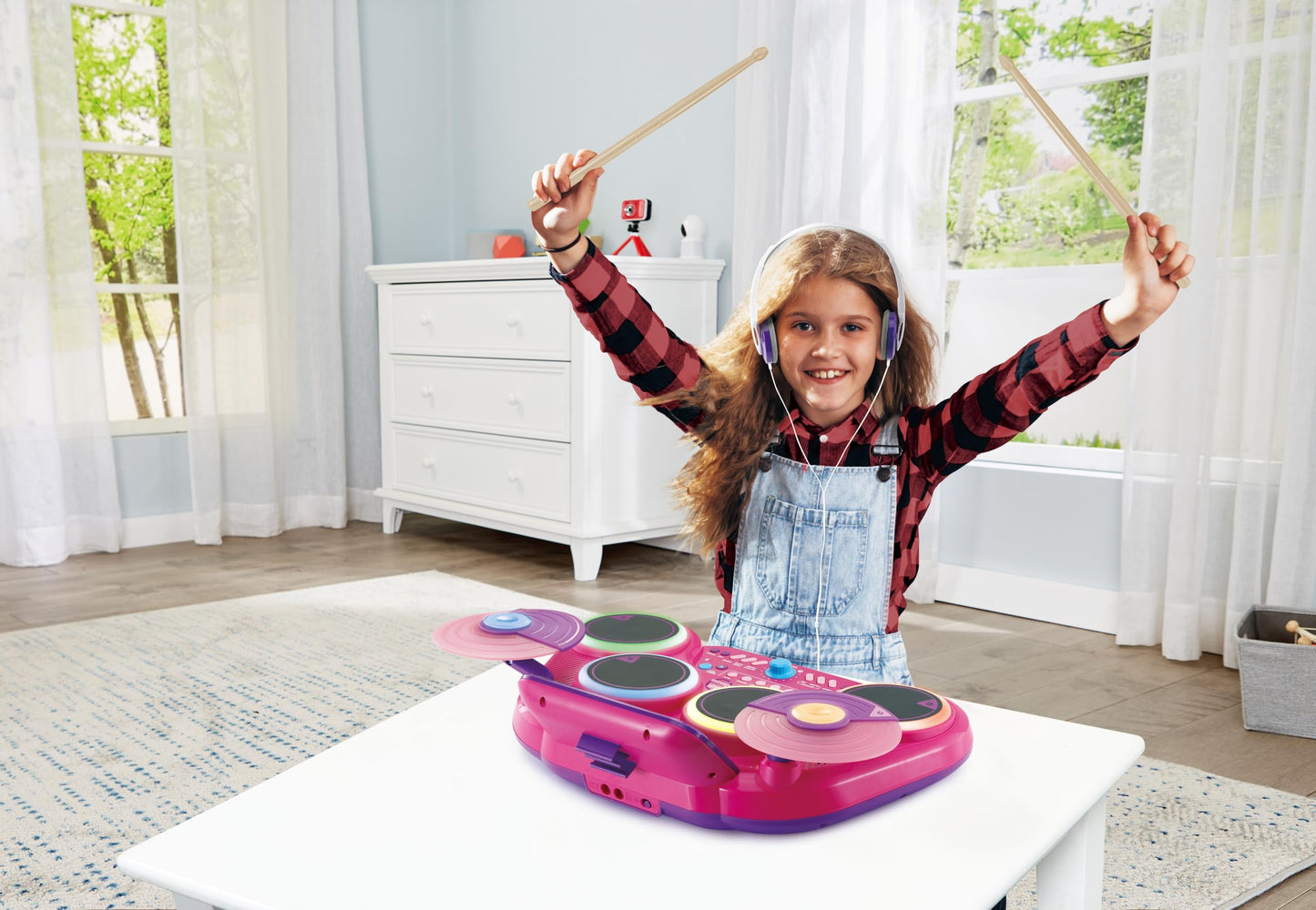 VTech Kidi DJ Drums pink light-up electronic drum kit with 4 drums, cymbals, drum sticks, Bluetooth, for kids aged 5 and up.