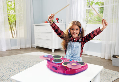 VTech Kidi DJ Drums pink light-up electronic drum kit with 4 drums, cymbals, drum sticks, Bluetooth, for kids aged 5 and up.