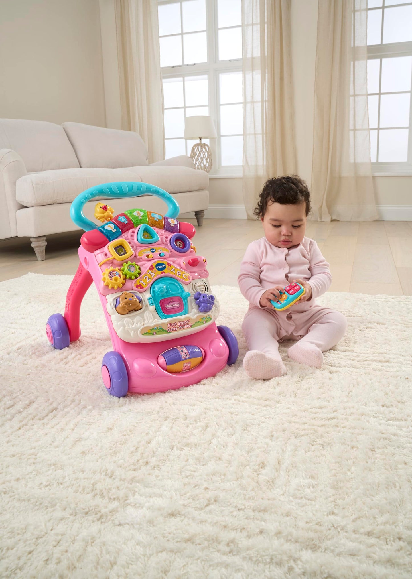 VTech First Steps Baby Walker in pink with shapes, sounds, music, and pretend play features for babies and toddlers.
