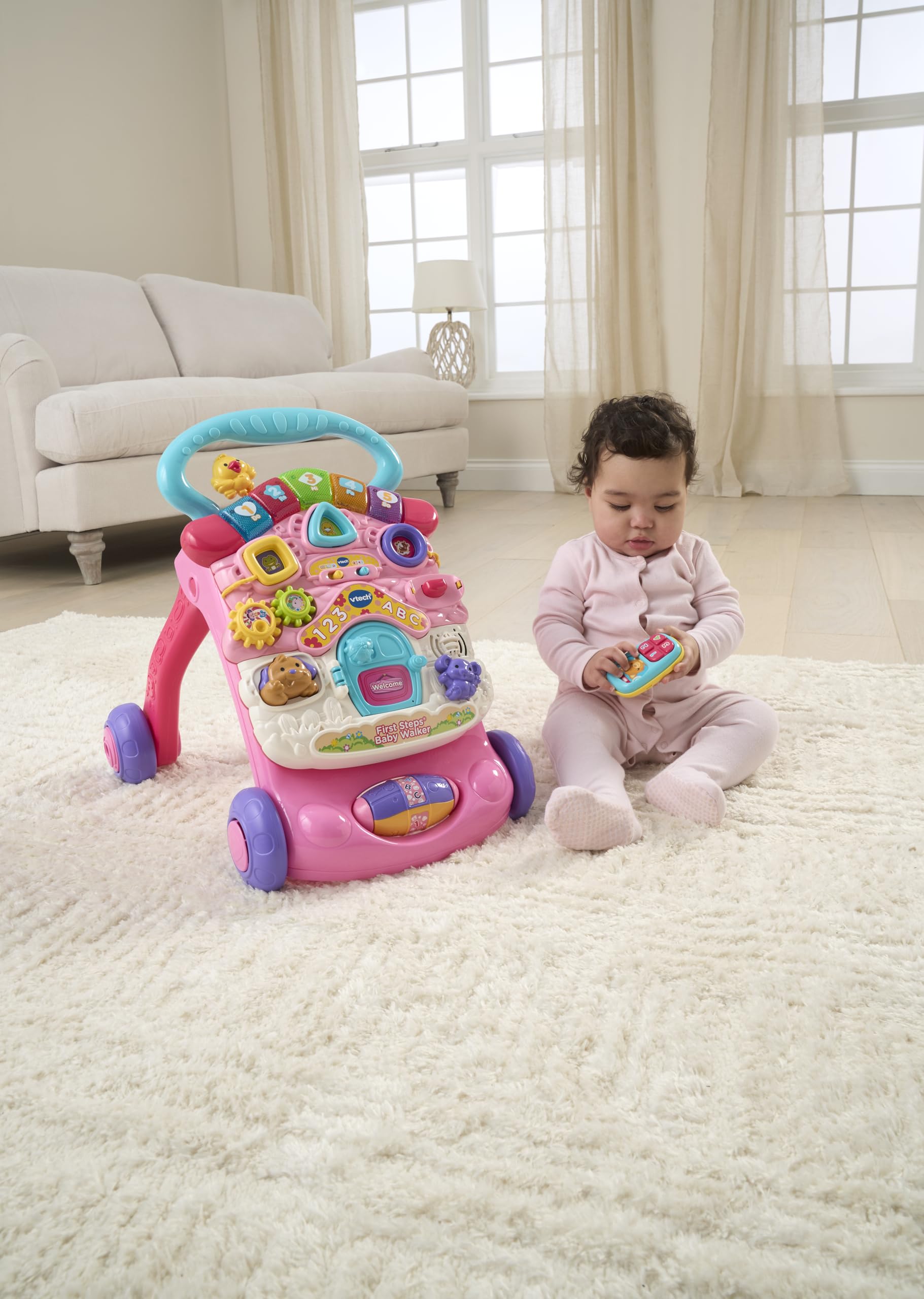 VTech First Steps Baby Walker in pink with shapes, sounds, music, and pretend play features for babies and toddlers.