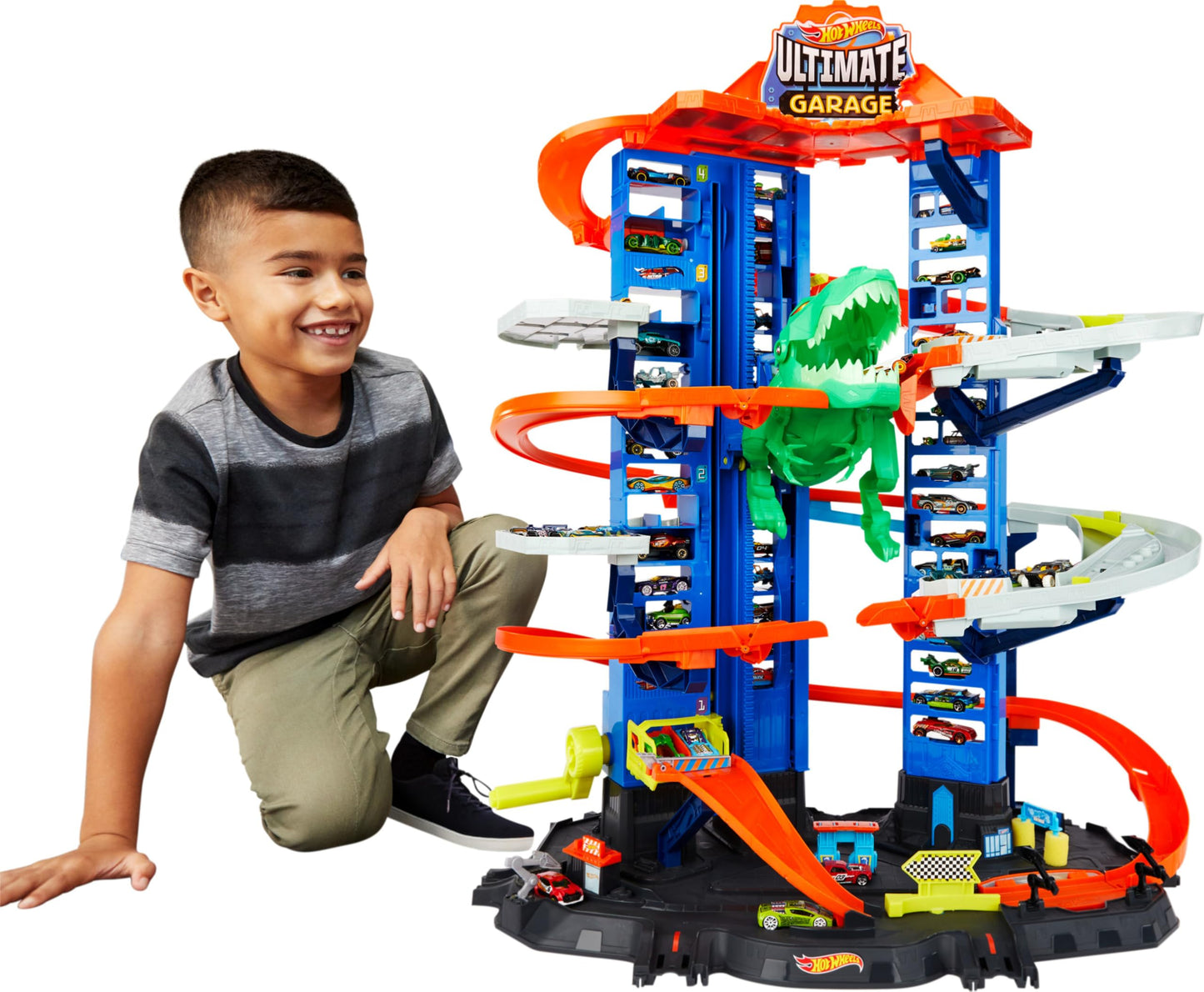 Hot Wheels City Ultimate Garage Playset with multi-level racetrack and moving T-Rex, accommodating 100 toy cars.