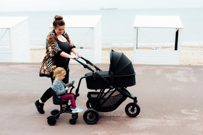 Roma Uptown 4 Wheel Toddler Seat & Steering Wheel, Universal Buggy Board with Seat, Side Attachment for Pushchairs & Buggies, Supports Up to 25kg, Eliminates Double Pram Need