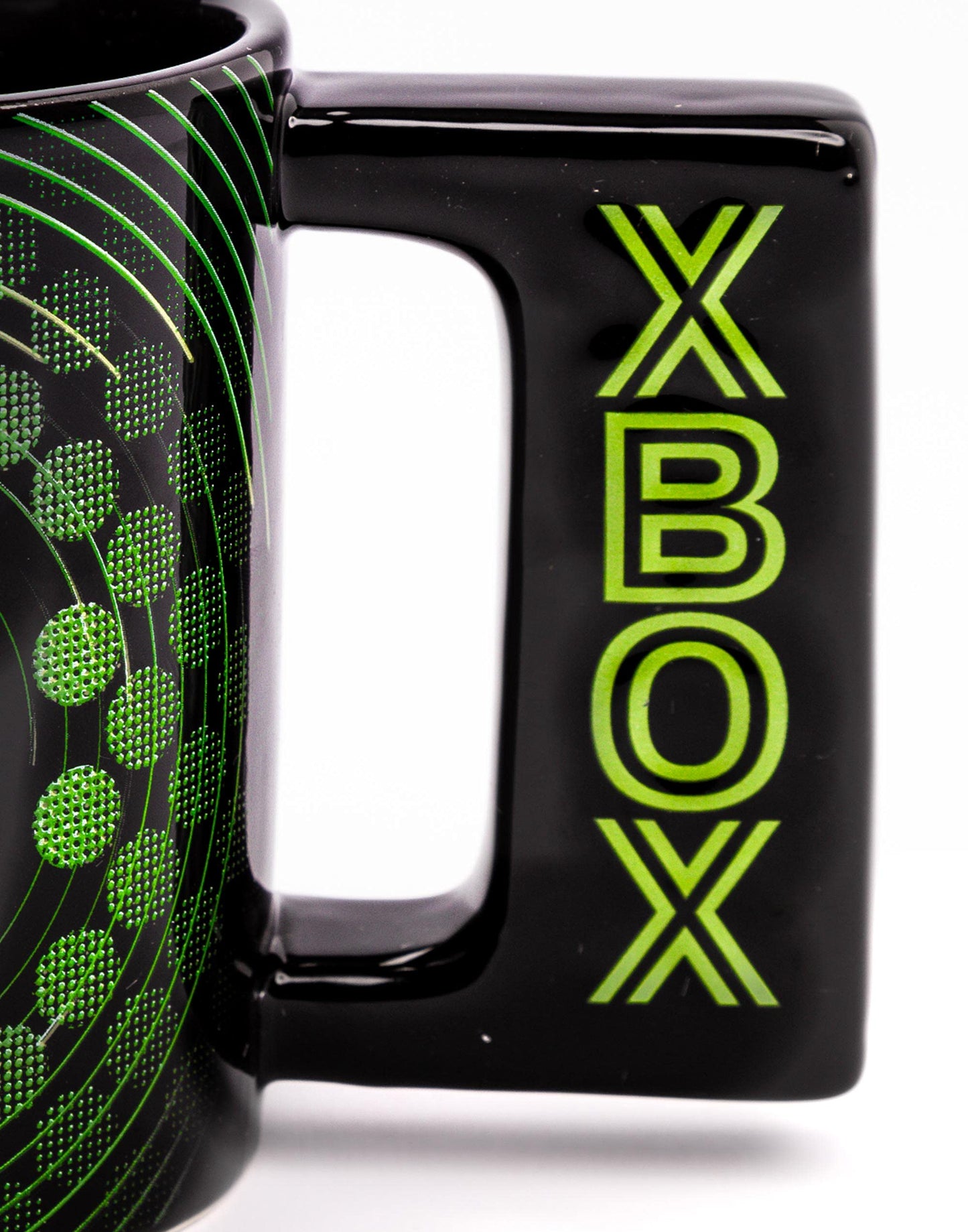 Black ceramic Xbox mug with green video game console logo, handle, 16oz capacity, ideal for gaming fans.