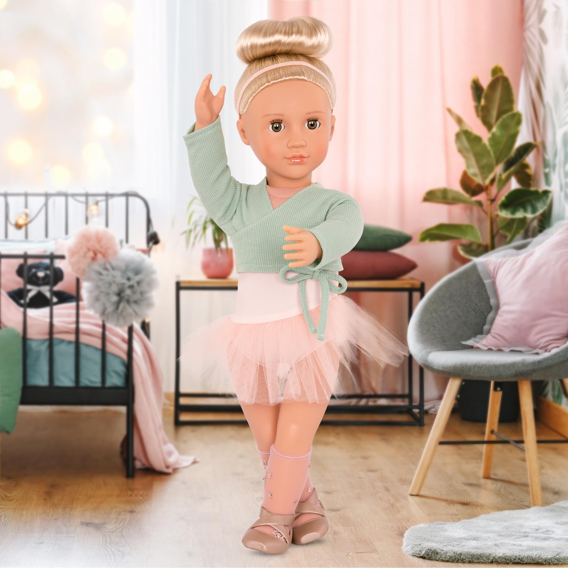Our Generation Viola Ballerina Doll in a pink tutu with dance clothing, featuring a soft body for realistic play.