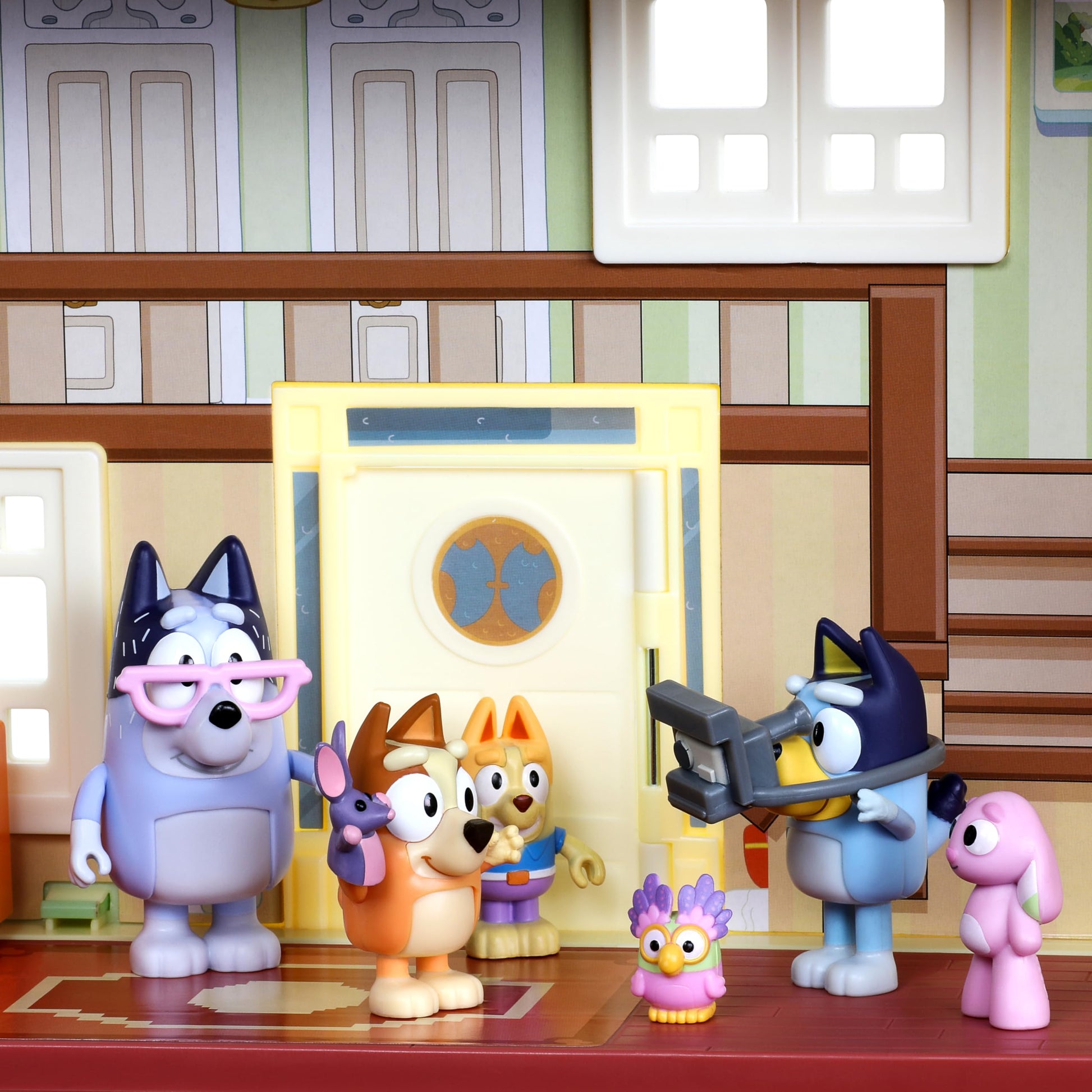 Bluey exclusive Ultimate Lights and Sounds Playhouse with toy box, 29 accessories, 4 characters, dance floor, lights, and 50 sounds and phrases.