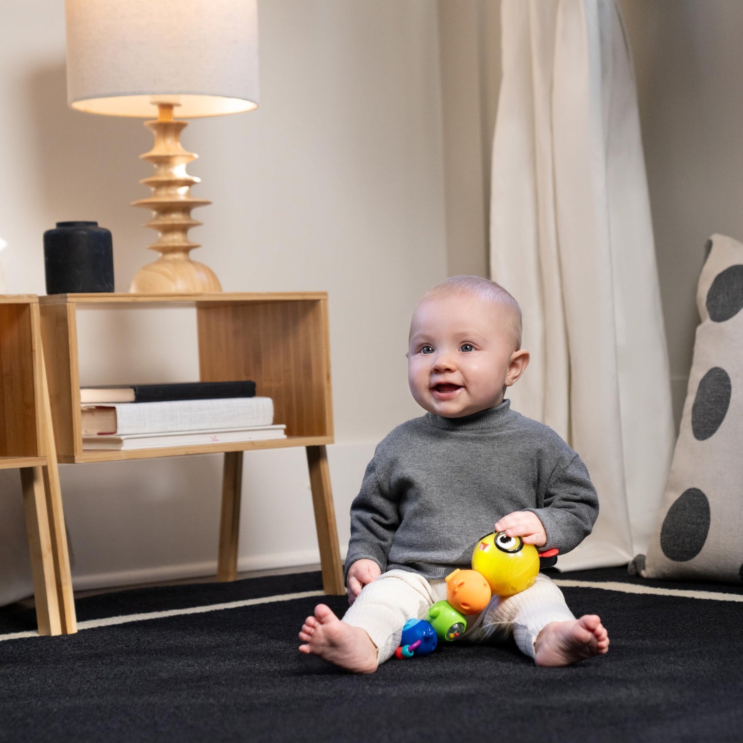 Baby Einstein Twist-a-Pal Cal sensory toy featuring colorful beads, music, and tactile elements for babies 6 months and older.