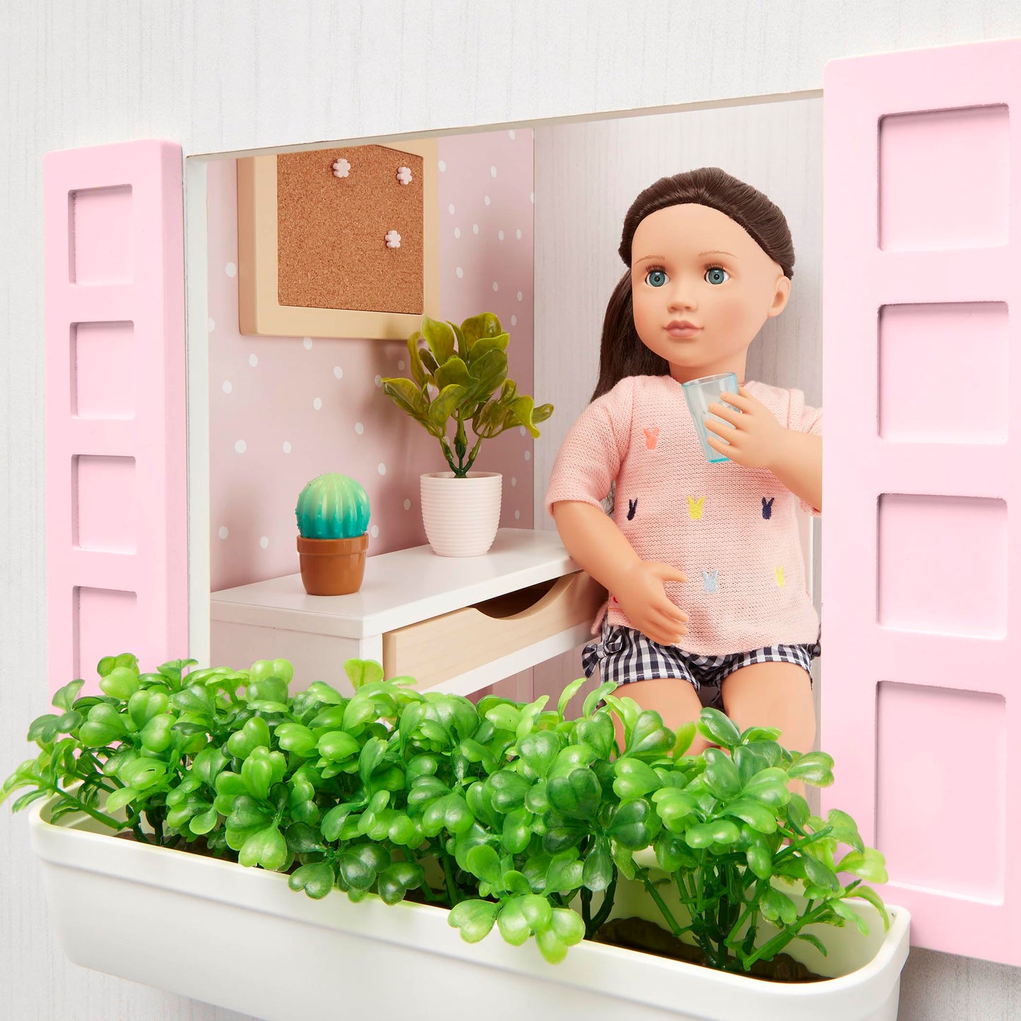 Our Generation dollhouse playset with movable furniture pieces for bedroom, kitchen, and bathroom, ideal for 18-inch dolls.