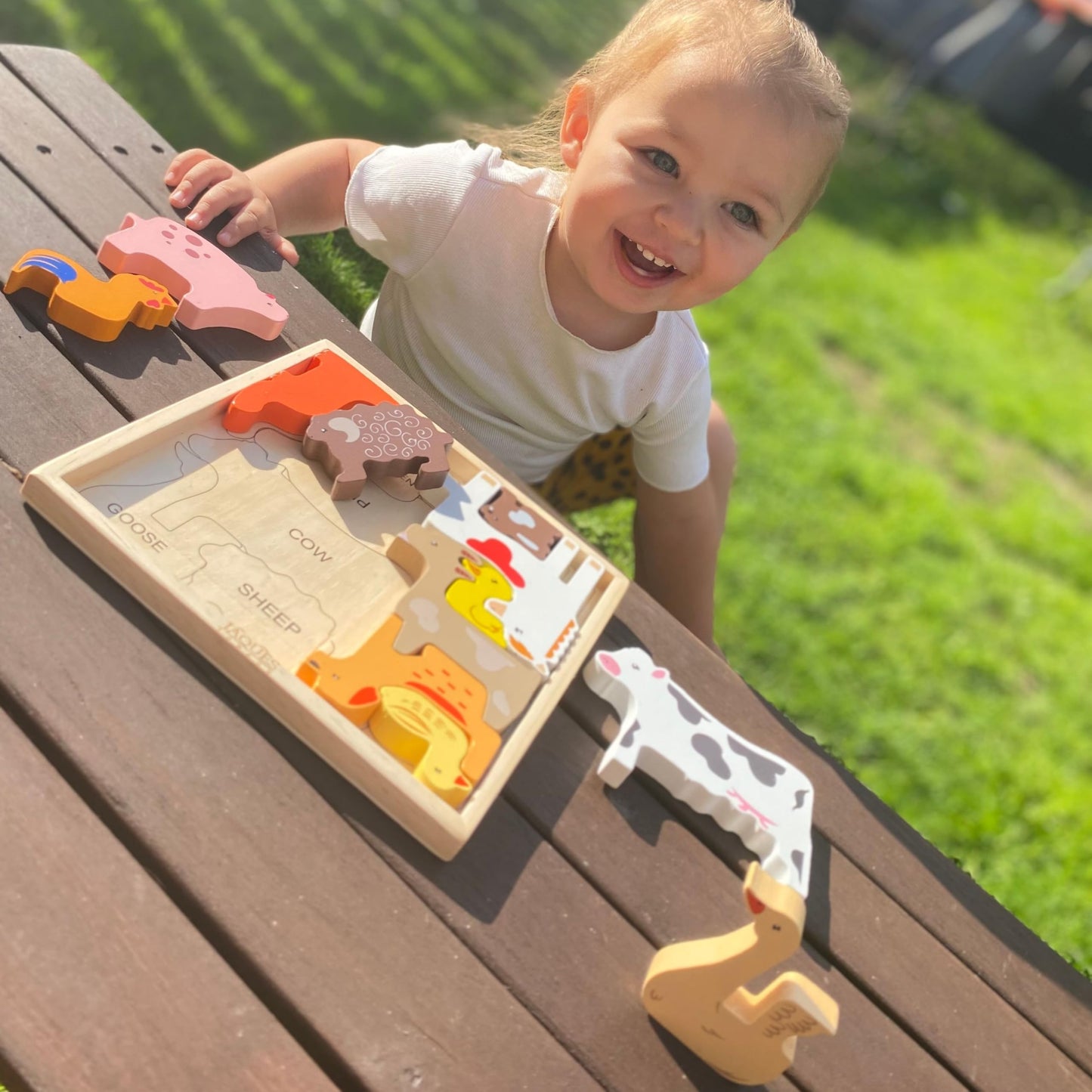 Wooden farm animal toys by Jaques of London, Montessori puzzles for 1-year-olds, includes cow, pig, and horse figures.