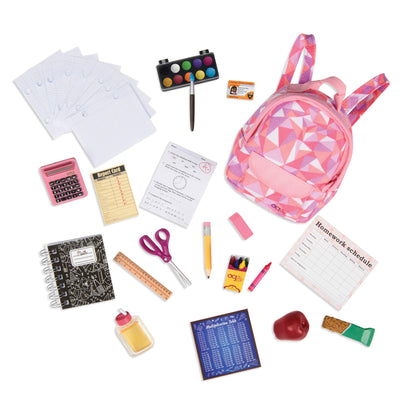 Our Generation Off To School doll accessories set featuring a backpack, books, notebook, and educational toy items for children aged 3+