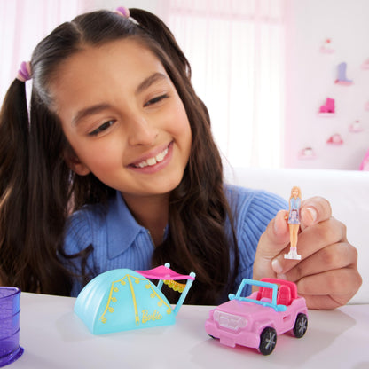 Mini BarbieLand doll and toy vehicle set including 1.5-inch Barbie doll, color-change SUV, and tent accessory by Barbie.