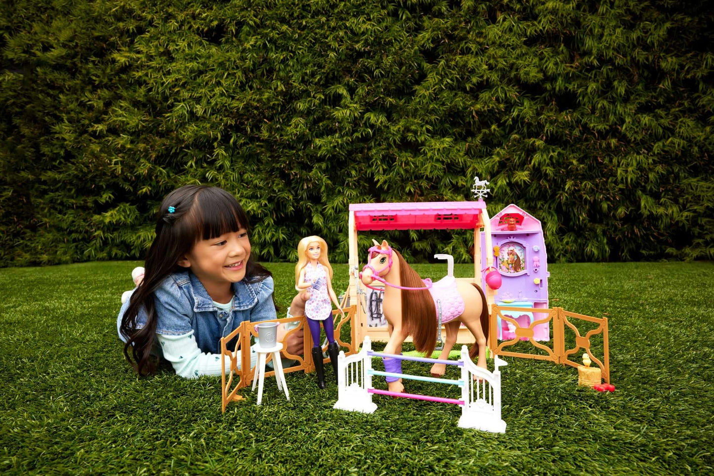 Barbie toy stable playset with doll, horse, and accessories, featuring 25+ pieces and six play areas inspired by Barbie Mysteries.