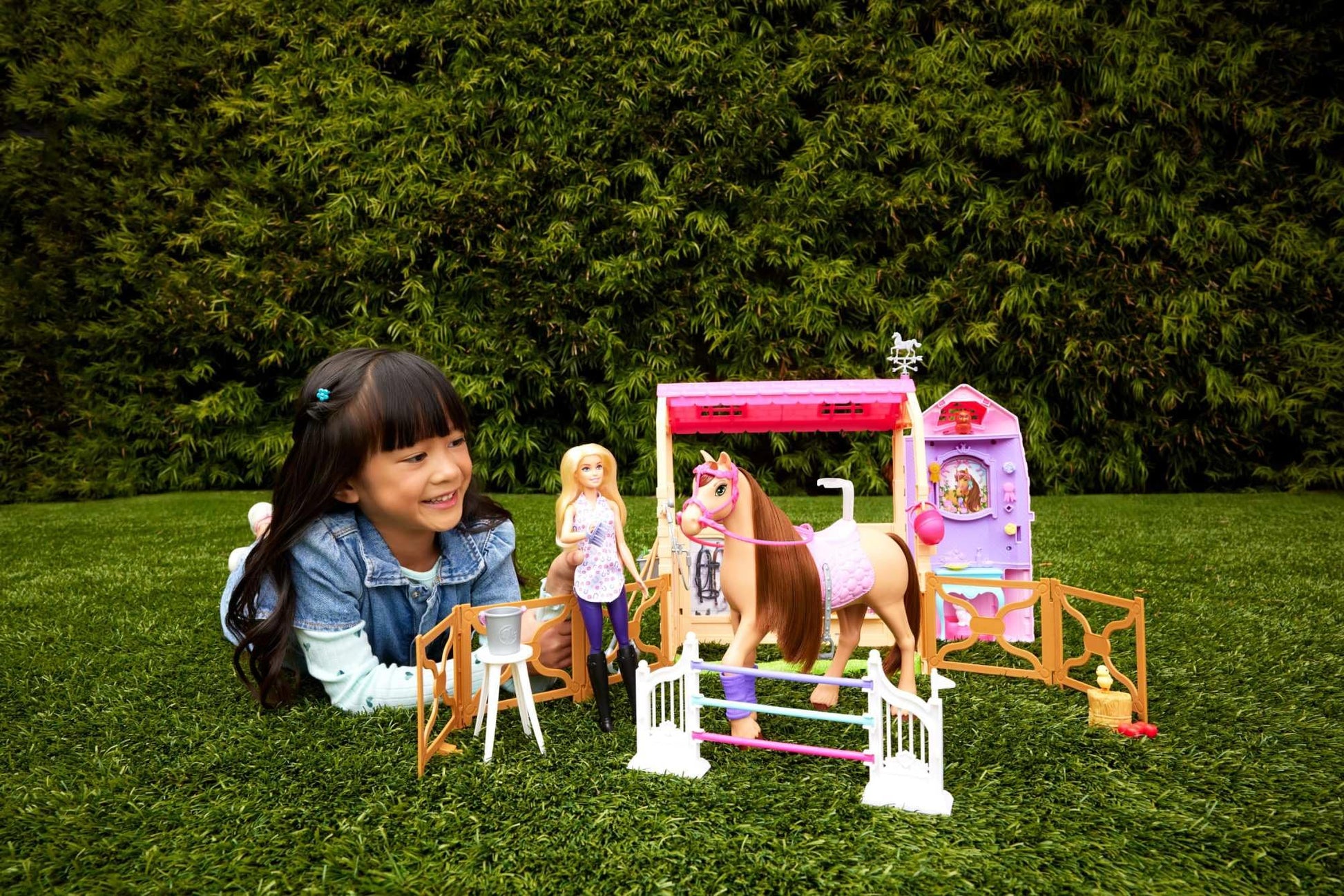 Barbie toy stable playset with doll, horse, and accessories, featuring 25+ pieces and six play areas inspired by Barbie Mysteries.