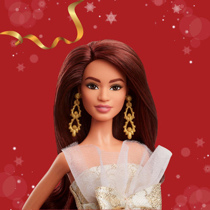 Barbie Signature 2025 Holiday fashion doll with dark brown hair in a silver and gold gown, displayed in collectible packaging.
