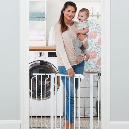 Regalo Easy Step Walk-Thru Baby Safety Gate with extension kit, pressure-mounted, showing the gate installed in a doorway.