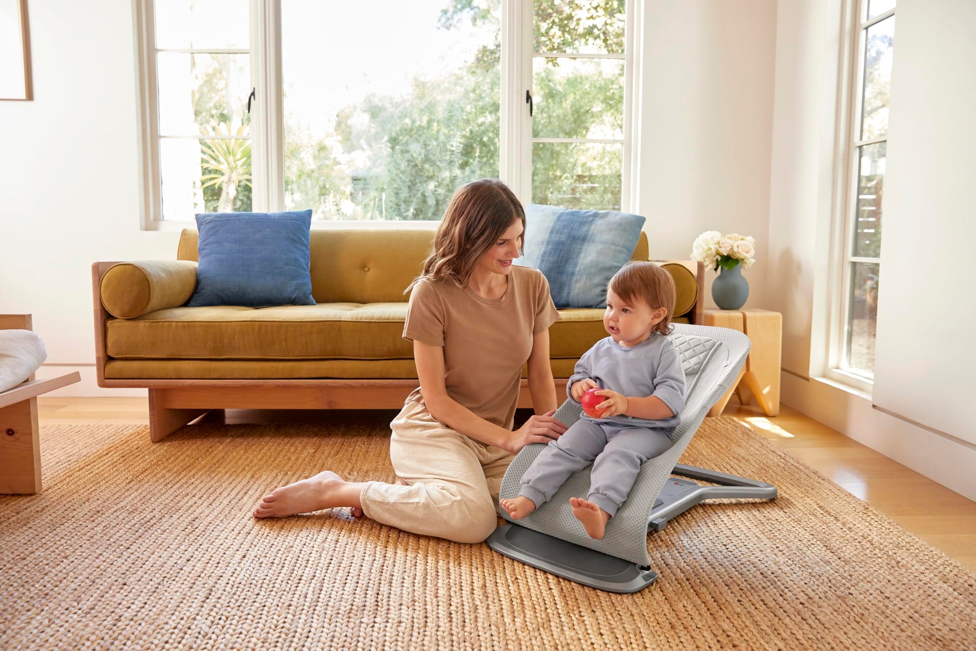 Ergobaby 3-in-1 Evolve Bouncer Mesh in light grey showing ergonomic baby rocker with breathable mesh fabric and newborn insert.