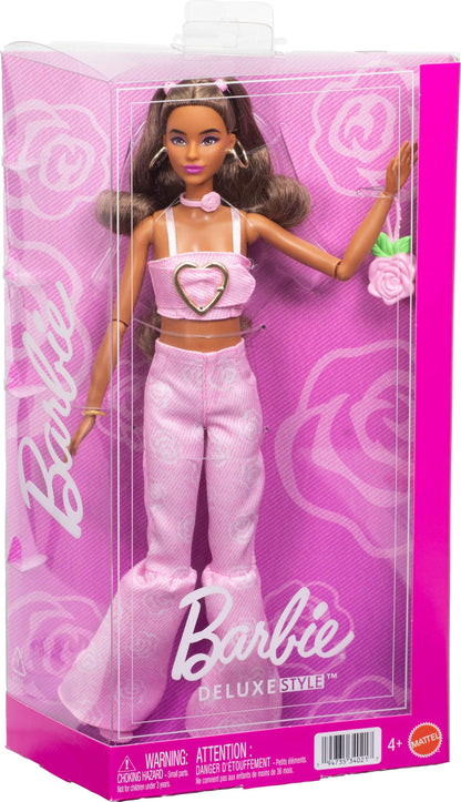 Barbie Deluxe Style Doll #12 wearing a pink denim crop top and rose print flare jeans, with wavy brown hair and accessories.