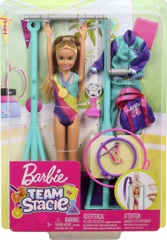 Barbie Team Stacie doll in gymnastics playset with spinning bar and colorful accessories for imaginative play.