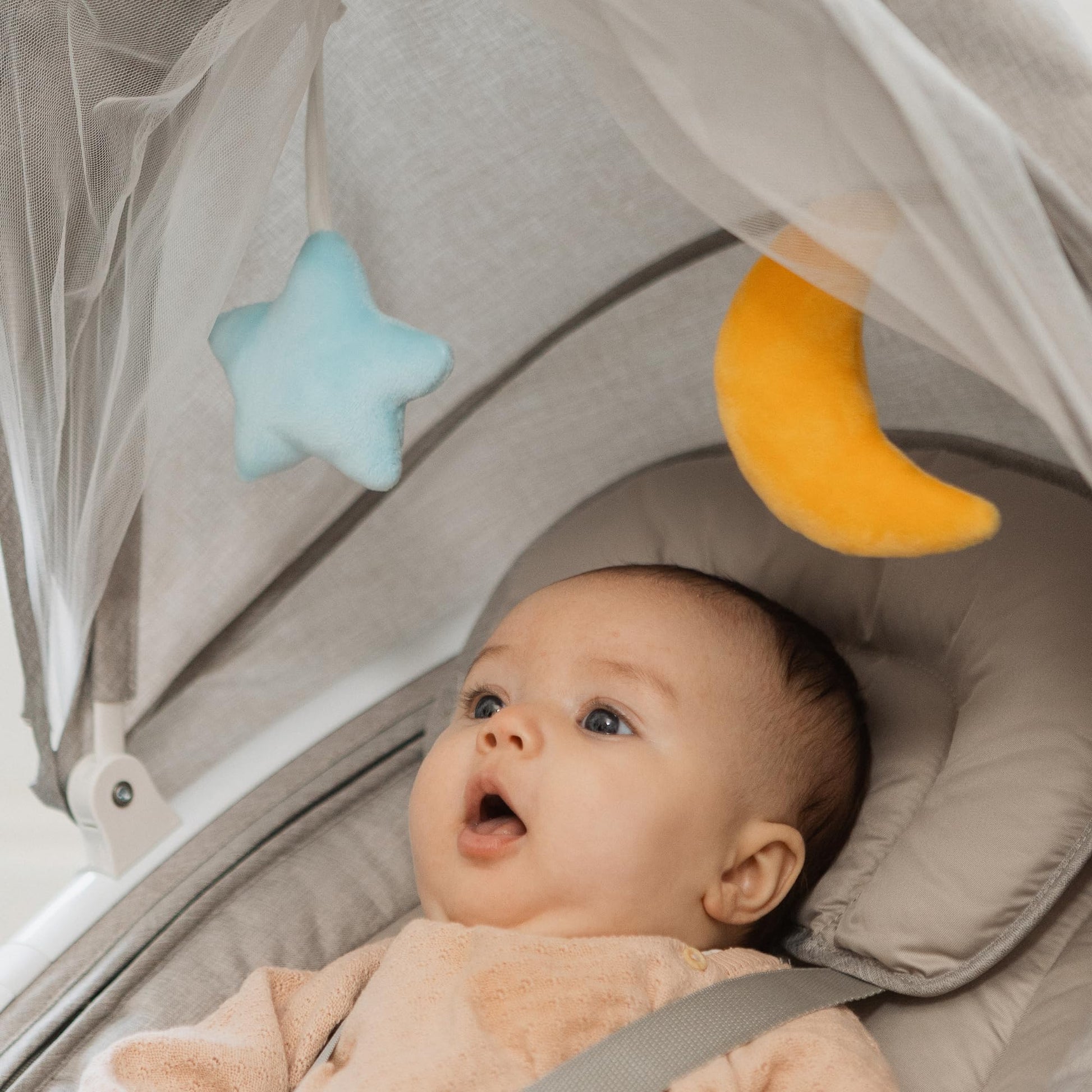 Nuby Connect baby swing chair in grey with a toy bar, canopy, remote control, suitable for newborns, musical bouncer with safety harness.