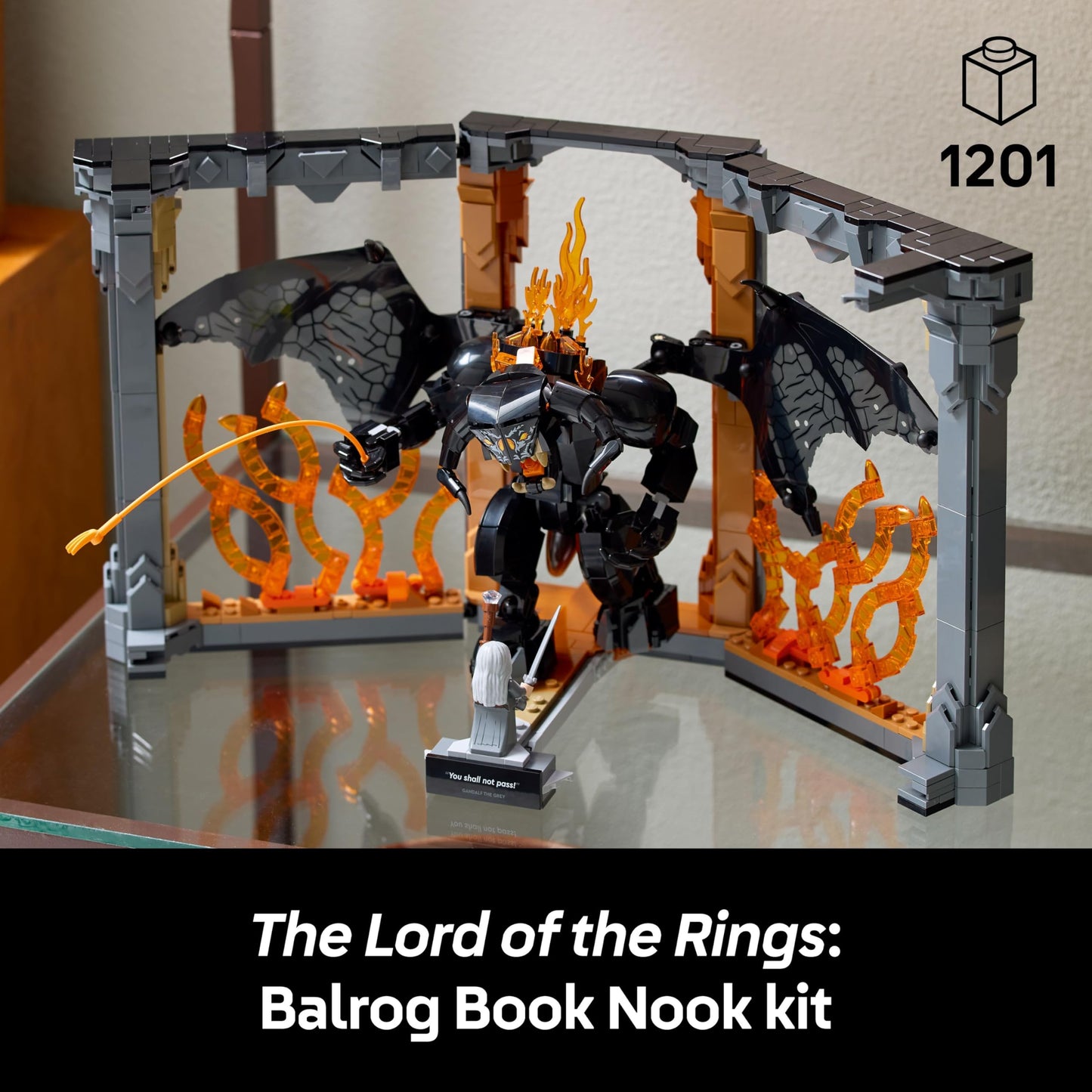 LEGO Icons Balrog Book Nook with Gandalf the Grey minifigure and dragon figure on a decorated bookshelf.