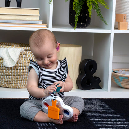 Baby Einstein Color Palette Popper sensory fidget toy showing colorful popper buttons for infants aged 6 months and up.