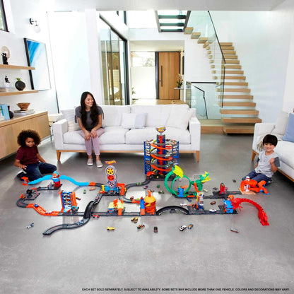Hot Wheels Track Builder Unlimited Fuel Can Stunt Box with track pieces and storage for toy cars, designed for ages 6 to 12.