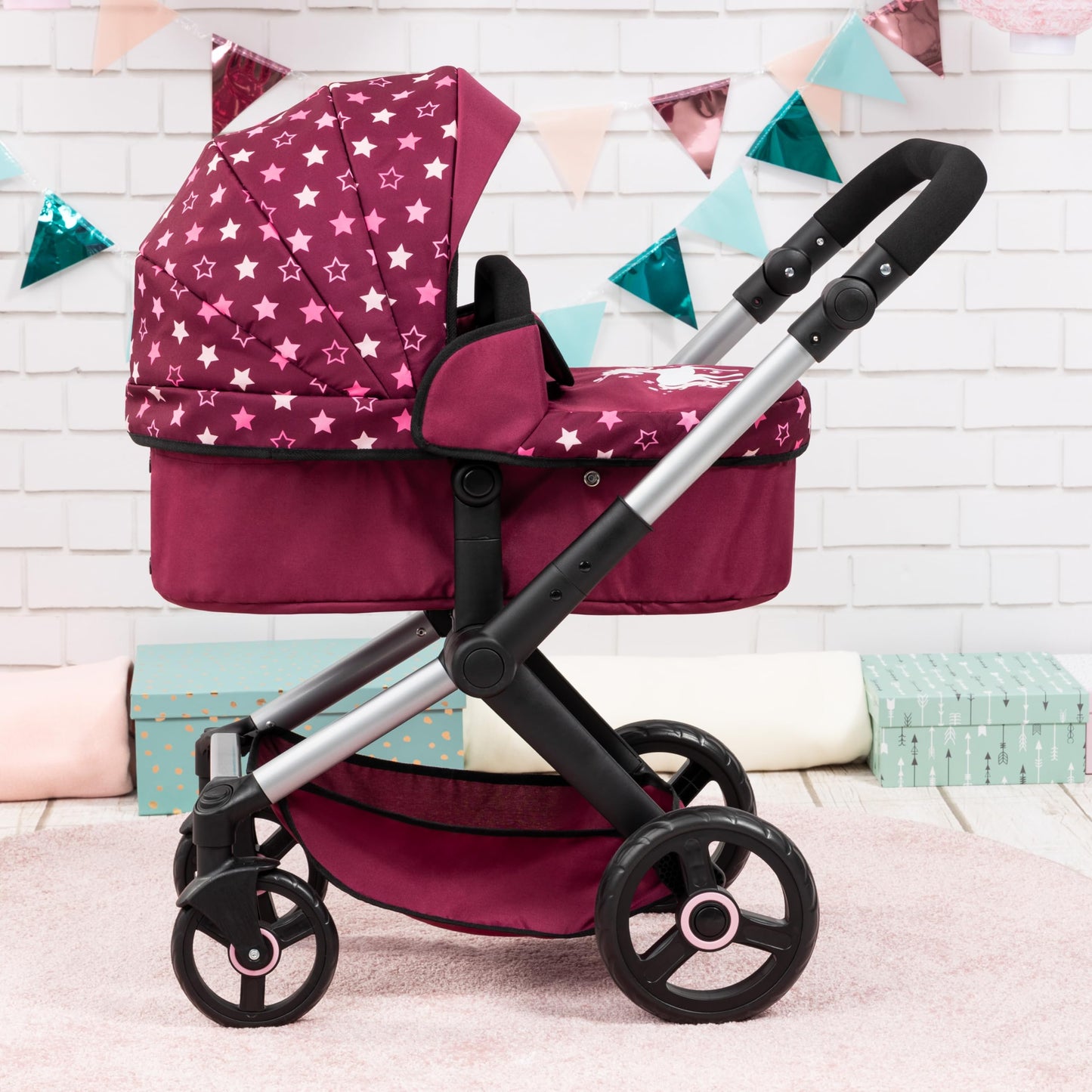 Bayer Baby Dolls Pram XEO in burgundy with pink stars, convertible doll stroller with carrycot, changing bag, and adjustable handle for girls