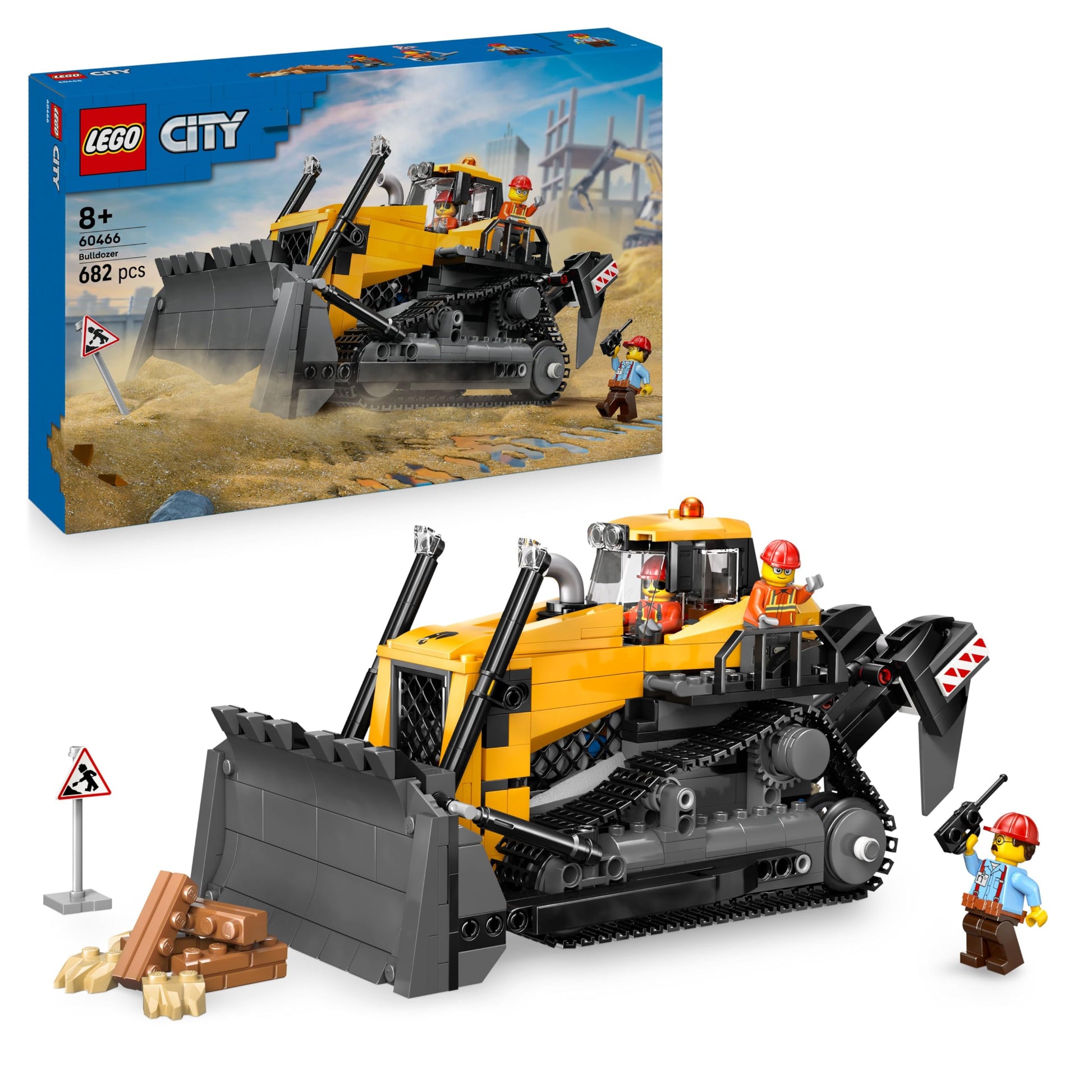 LEGO City yellow bulldozer building set with three minifigures, loose bricks, and road signs for construction play.