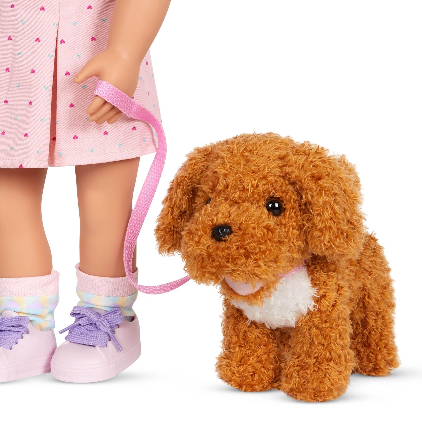 Our Generation poodle dog plush in a pet carrier bag, perfect for 18-inch doll accessories and kids 3+ years.