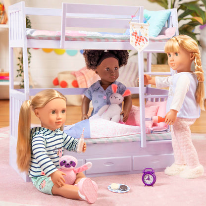 Our Generation 46 cm sleepover doll in pajamas with a soft toy rabbit, ideal for kids' cozy sleepover fun.