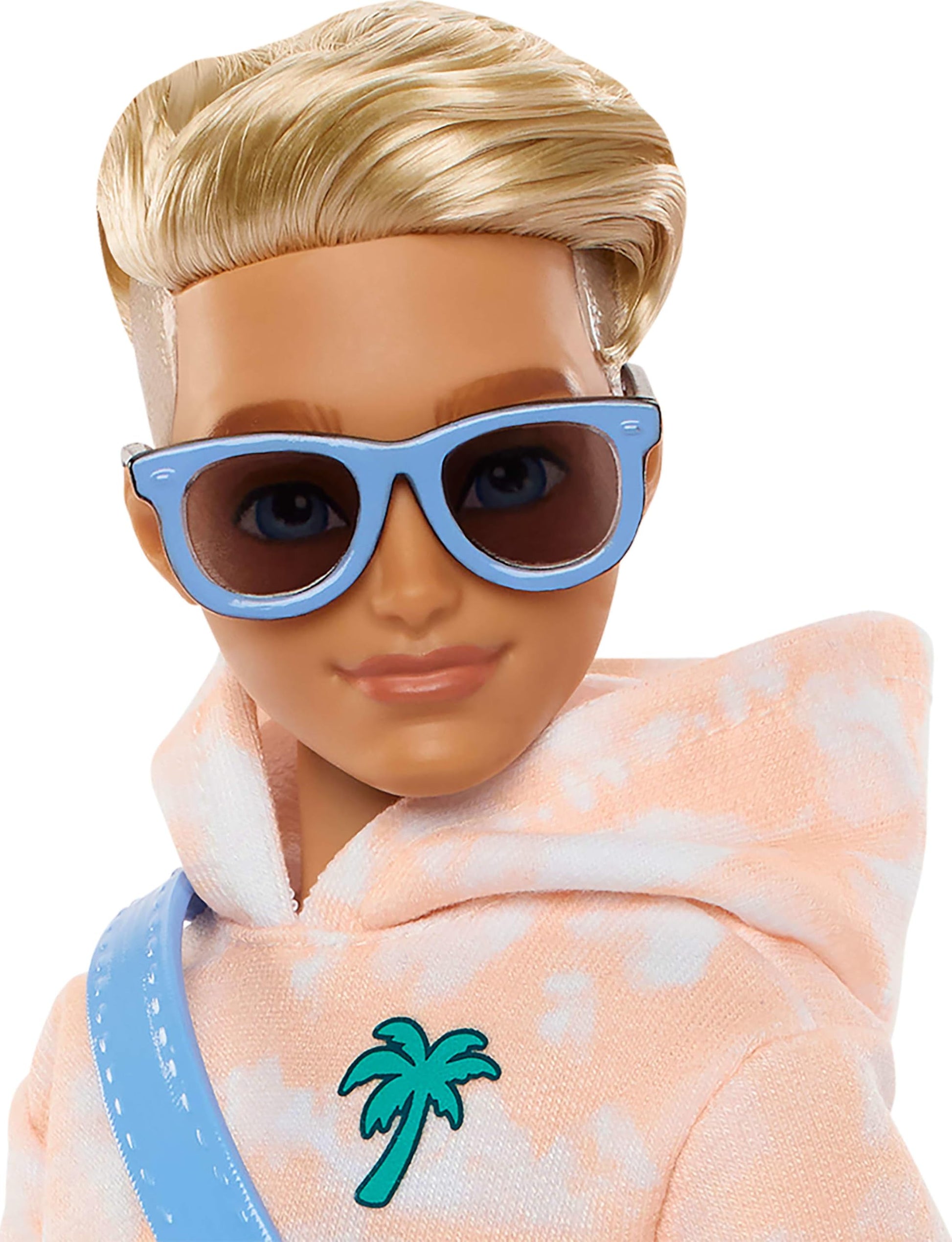 Barbie Dream Besties Ken doll with blonde hair, poseable fashion doll, includes skateboard and summer-themed accessories.