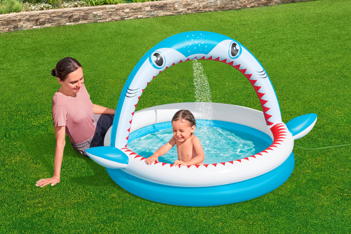 Bestway Shark Kids Inflatable Sprinker Play Pool with vibrant shark design, measuring 1.63m x 1.27m x 92cm.