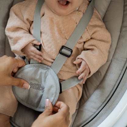 Nuby Connect baby swing chair in grey with toy bar, canopy, remote control, and musical bouncer for infants from birth.